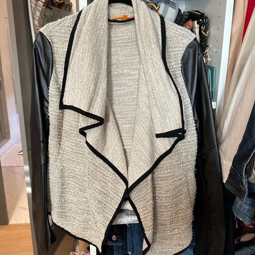 Medium light jacket with vegan leather sleeves, boutique purchase. Knit front.
